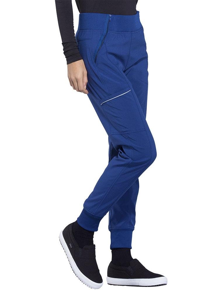 Cherokee Infinity Women's Mid Rise Tapered Jogger in royal featuring front angled zipper pockets