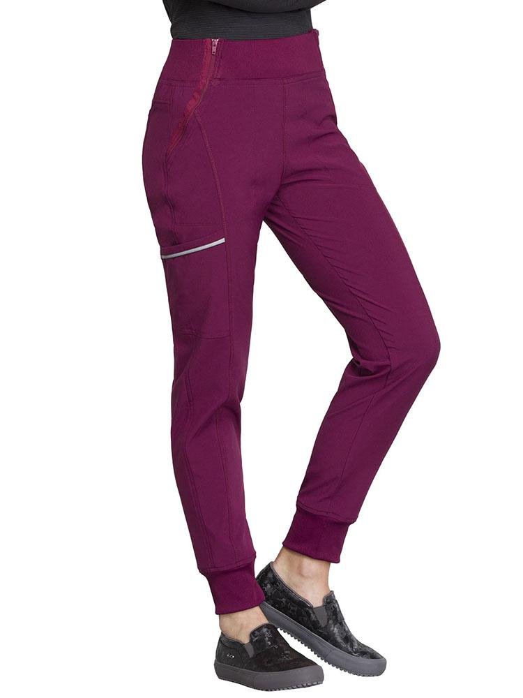 Cherokee Infinity Women's Mid Rise Tapered Jogger in wine featuring a cargo pocket with reflective tape