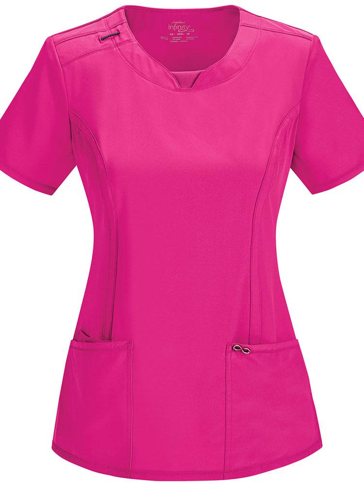 A frontward facing image of a Cherokee Infinity Women's Round Neck Scrub Top in Carmine Pink size XS featuring a bungee I.D. badge loop on the right shoulder.