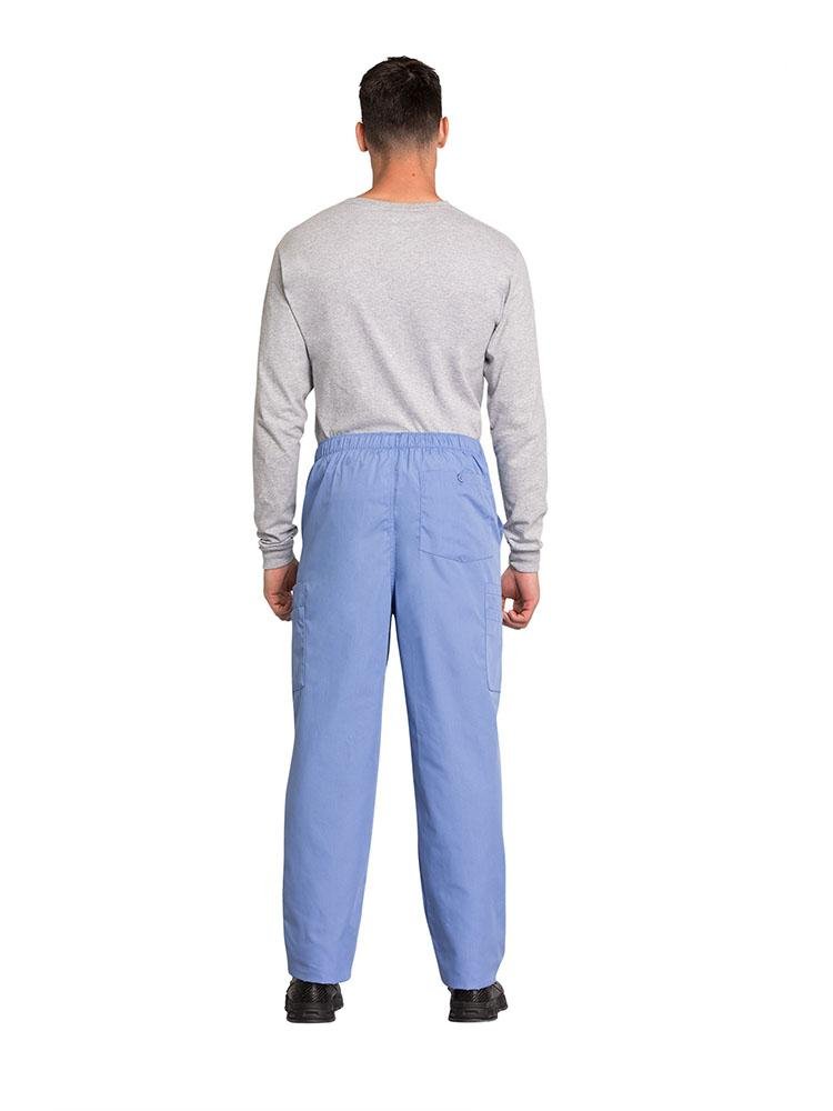 A male Physical Therapist wearing a Cherokee Workwear Originals Men's Drawstring Cargo Scrub Pant in Ceil size XL featuring 1 back patch pocket & 4 side cargo pockets.