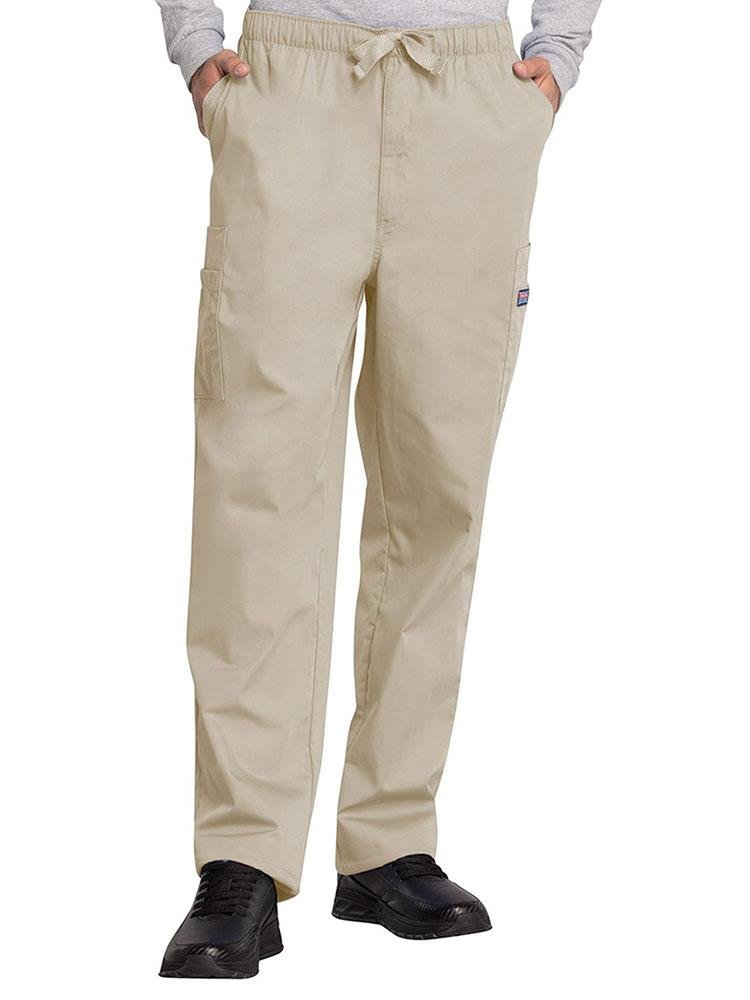 A young male Occupational Therapist wearing a Cherokee Workwear Originals Men's Drawstring Cargo Scrub Pant in Khaki size Medium featuring an elastic waistband with a webbed drawstring.