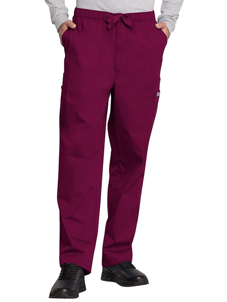 A young male Optometrist wearing a Cherokee Workwear Originals Men's Drawstring Cargo Scrub Pant in Wine size 3XL featuring an elastic waistband with a webbed drawstring.