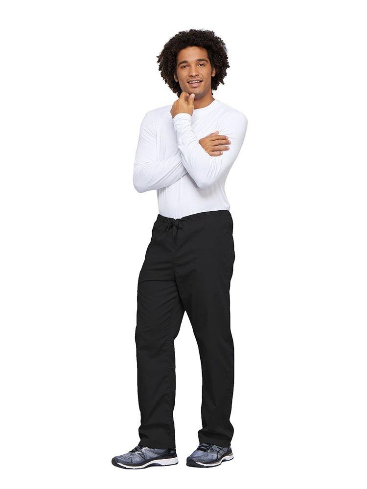A young male Nurse wearing a Cherokee Workwear Unisex Drawstring Cargo Pant in Black size 4XL featuring an inseam of 31".