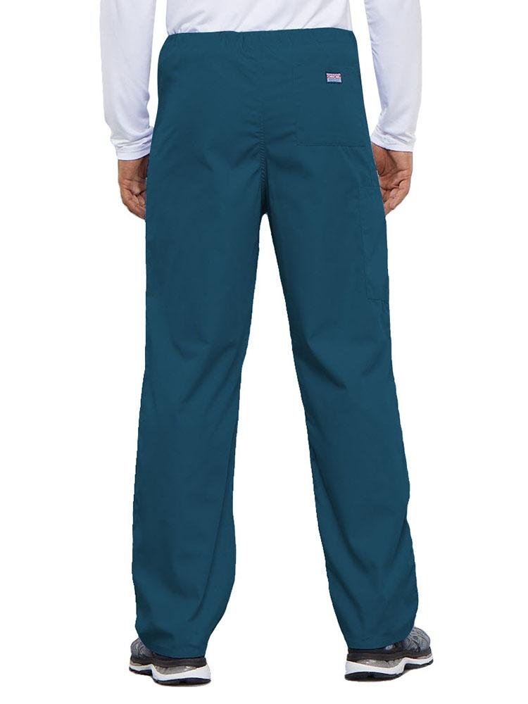 A young male Physical Therapist wearing a Cherokee Workwear Originals Unisex Drawstring Cargo Scrub Pant in Caribbean featuring 1 back pocket.