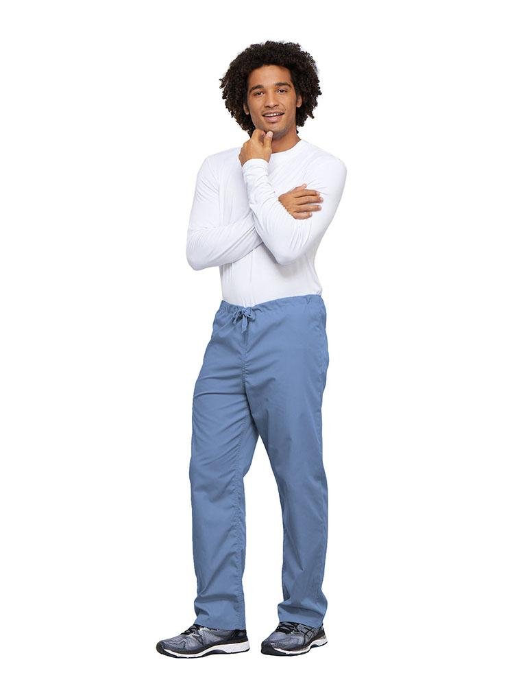 A young male Nurse wearing a Cherokee Workwear Unisex Drawstring Cargo Pant in Ceil size 4XL featuring an inseam of 31".