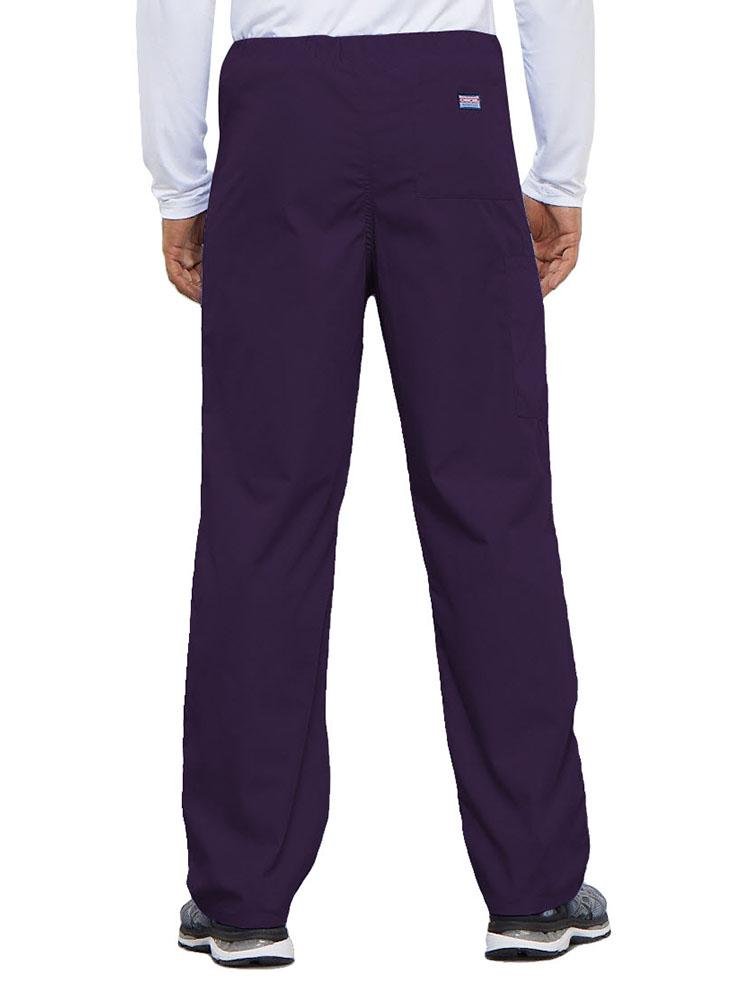 A young male Physical Therapist wearing a Cherokee Workwear Originals Unisex Drawstring Cargo Scrub Pant in Eggplant featuring 1 back pocket.