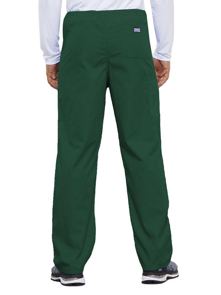 A young male Physical Therapist wearing a Cherokee Workwear Originals Unisex Drawstring Cargo Scrub Pant in Hunter Green featuring 1 back pocket.
