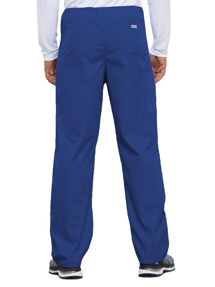 A young male Physical Therapist wearing a Cherokee Workwear Originals Unisex Drawstring Cargo Scrub Pant in Royal featuring 1 back pocket.
