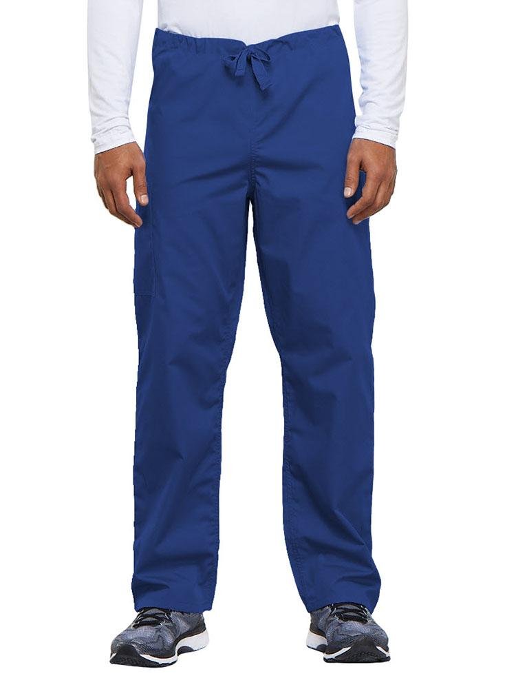 A young male Nurse Practitioner wearing a Cherokee Workwear Originals Unisex Drawstring Cargo Scrub Pant in Royal size Medium Short featuring a total of 3 pockets.