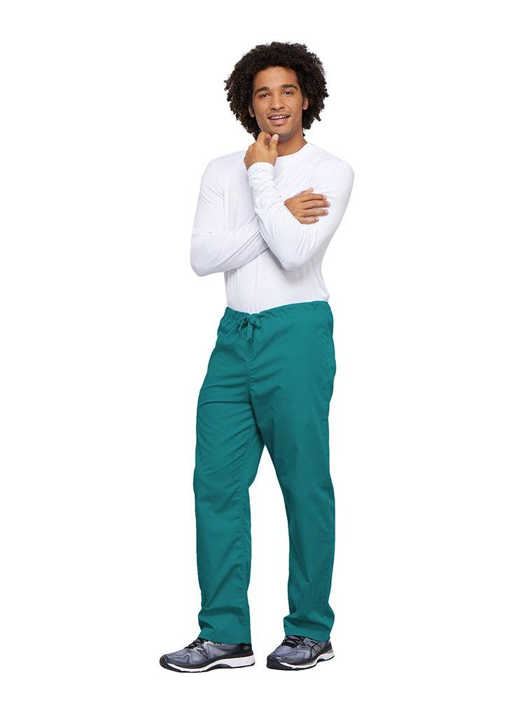A young male Nurse wearing a Cherokee Workwear Unisex Drawstring Cargo Pant in Ceil size 4XL featuring an inseam of 31".