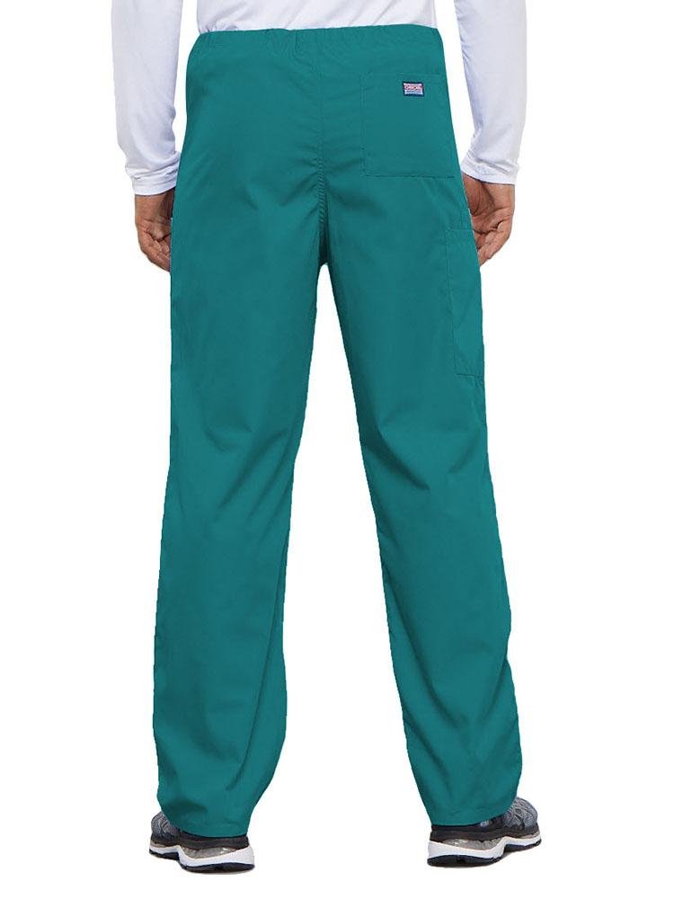 A young male Physical Therapist wearing a Cherokee Workwear Originals Unisex Drawstring Cargo Scrub Pant in Teal featuring 1 back pocket.