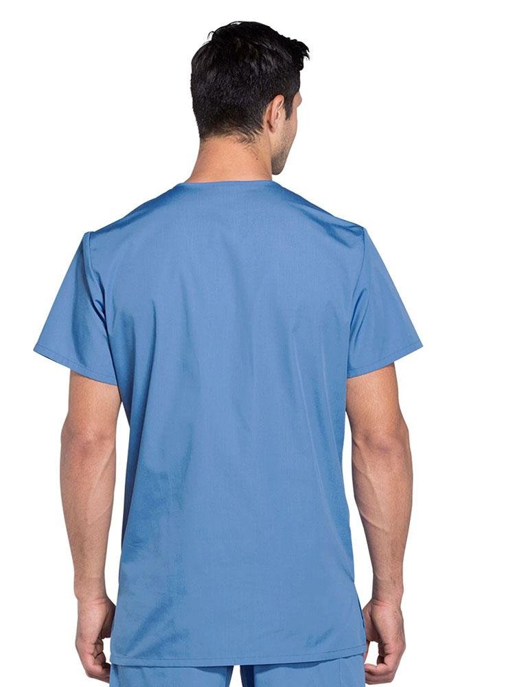 A male LPN showing the back of a Cherokee Workwear Originals Unisex Multi-pocket V-neck Scrub Top in Ceil size Large featuring a center back length of 29".