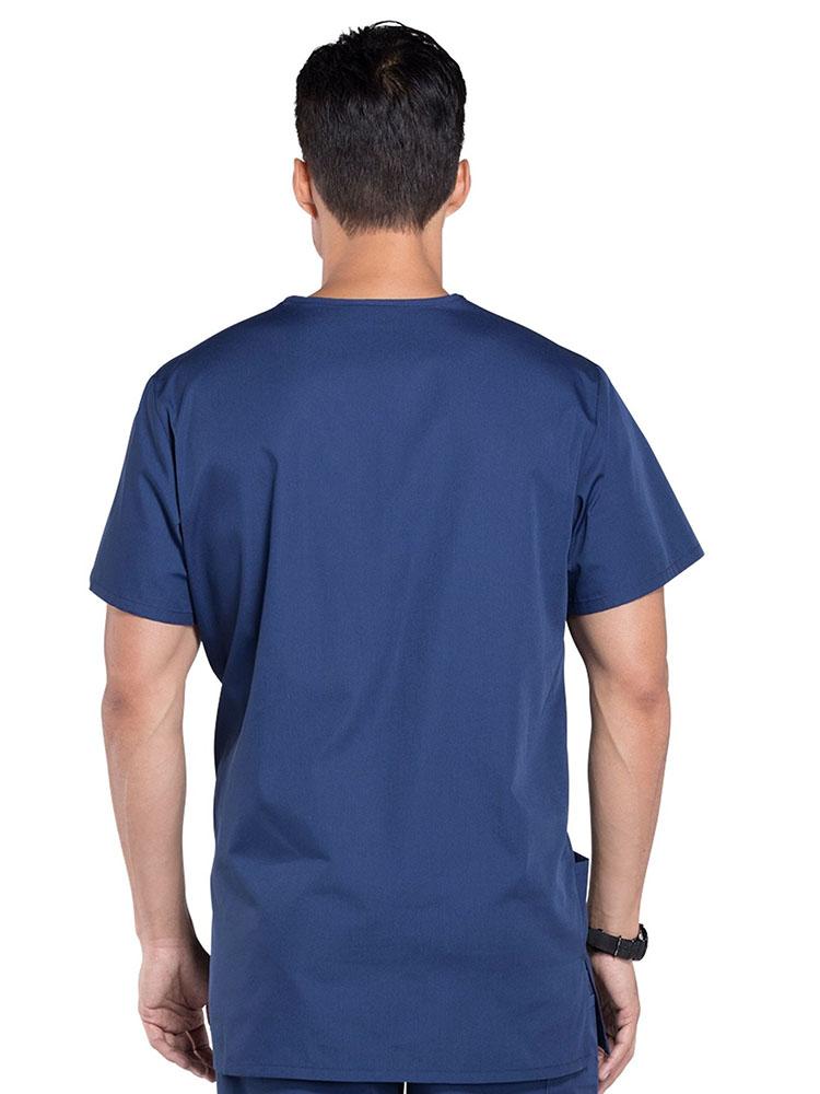 A male Respiratory Therapist showing the back of a Cherokee Workwear Originals Unisex Multi-pocket V-neck Scrub Top in Navy size Large featuring a center back length of 29".