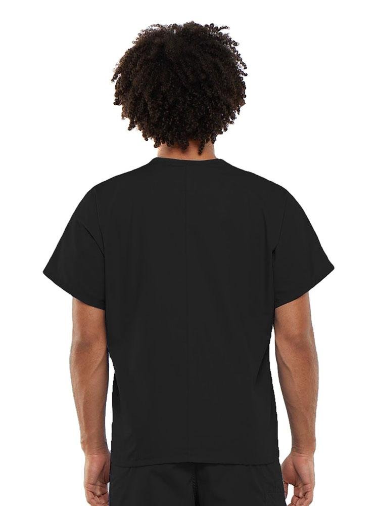 A young male Clinical Laboratory Technician wearing a Cherokee Workwear Originals Unisex Single Pocket V-neck Scrub Top in Black size Large featuring a center back length of 27.5".