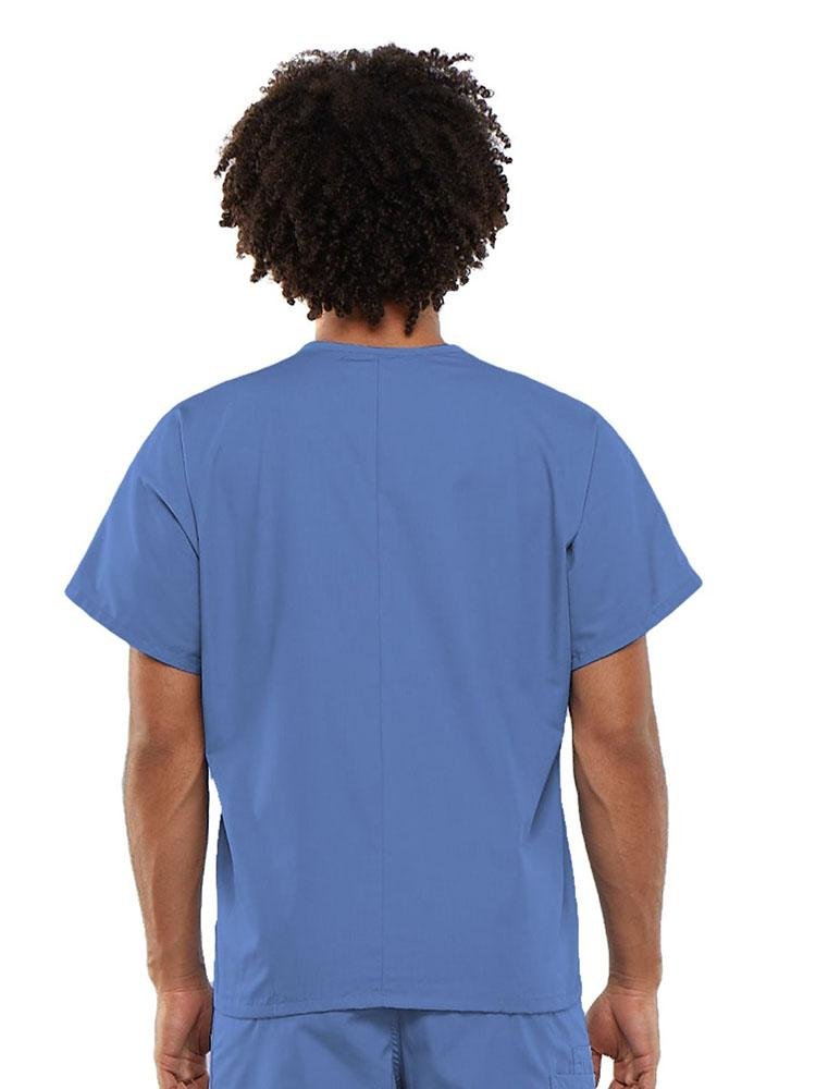 A young male Clinical Laboratory Technician wearing a Cherokee Workwear Originals Unisex Single Pocket V-neck Scrub Top in Ceil size Large featuring a center back length of 27.5".
