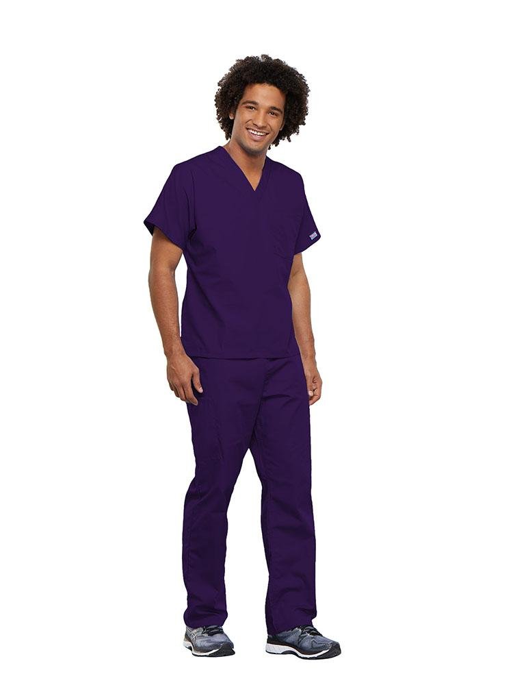 A male Physician wearing a Cherokee Workwear Originals unisex Single Pocket V-Neck Scrub Top in Eggplant size 5XL featuring 1 spacious chest pocket.