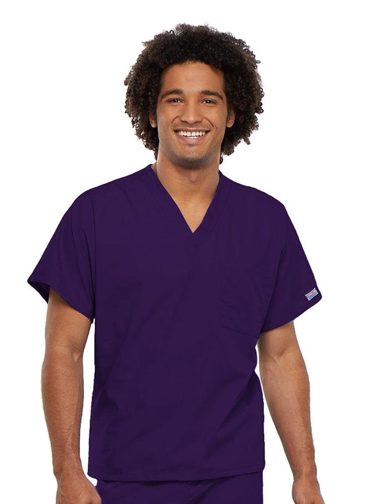 A young male RN wearing a Cherokee Workwear Originals Unisex Single Pocket V-neck Scrub Top in Eggplant size 4XL featuring short sleeves.