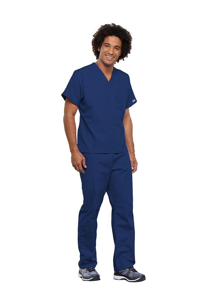 A male Nursing Assistant wearing a Cherokee Workwear Originals unisex Single Pocket V-Neck Scrub Top in Galaxy Blue  size 5XL featuring 1 spacious chest pocket.