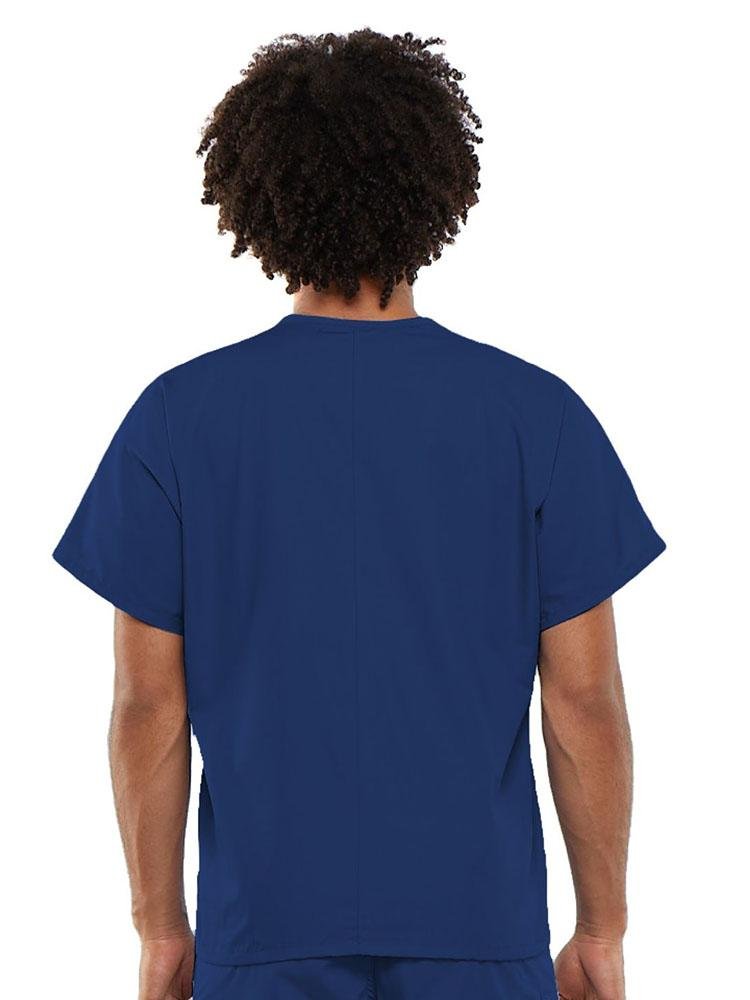 A young male LPN wearing a Cherokee Workwear Originals Unisex Single Pocket V-neck Scrub Top in Galaxy Blue size Large featuring a center back length of 27.5".