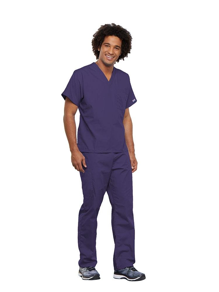 A male Pharmacy Technician wearing a Cherokee Workwear Originals unisex Single Pocket V-Neck Scrub Top in Grape size 5XL featuring 1 spacious chest pocket.