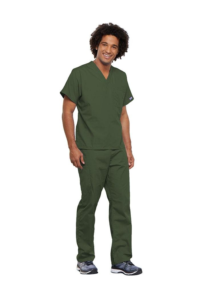 A male Surgical Technologist wearing a Cherokee Workwear Originals unisex Single Pocket V-Neck Scrub Top in Olive size 5XL featuring 1 spacious chest pocket.