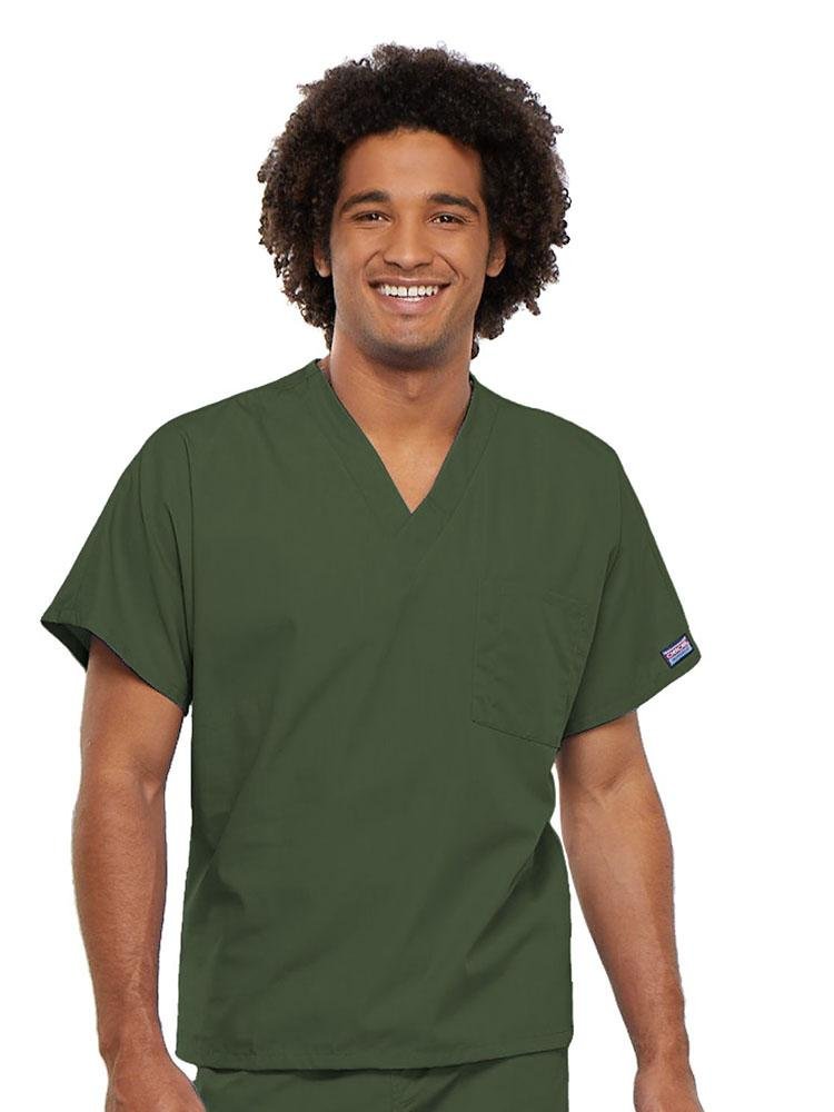 A young male Occupational therapy Aide wearing a Cherokee Workwear Originals Unisex Single Pocket V-neck Scrub Top in Olive size 4XL featuring short sleeves.