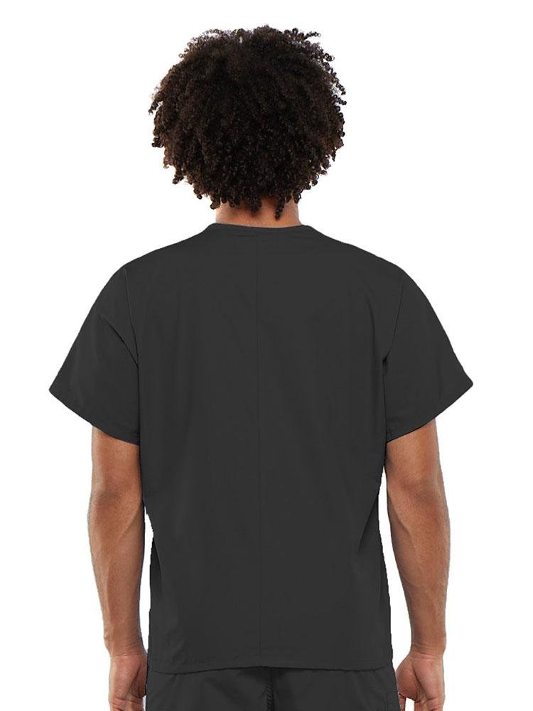 A young male Clinical Laboratory Technician wearing a Cherokee Workwear Originals Unisex Single Pocket V-neck Scrub Top in Pewter  size Large featuring a center back length of 27.5".