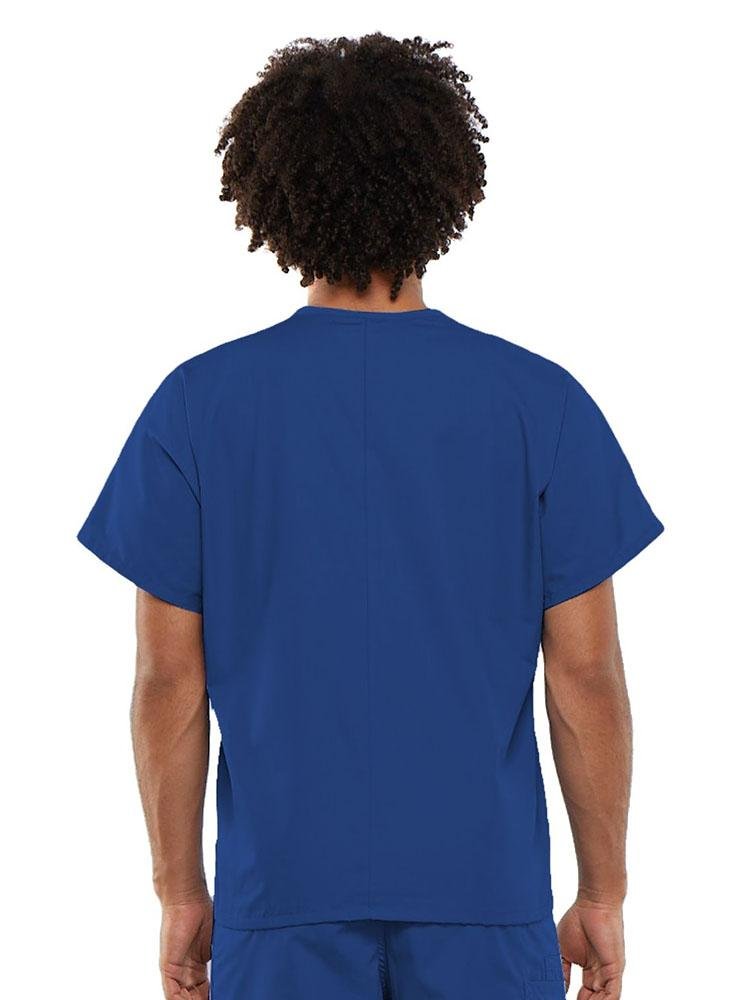 A young male Clinical Laboratory Technician wearing a Cherokee Workwear Originals Unisex Single Pocket V-neck Scrub Top in Royal size Large featuring a center back length of 27.5".