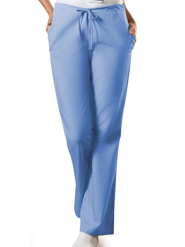 A young female Medical Assistant wearing a Cherokee Workwear Originals Women's Drawstring Flare Leg Scrub Pant in Ceil size Large Petite featuring an adjustable drawstring waist.