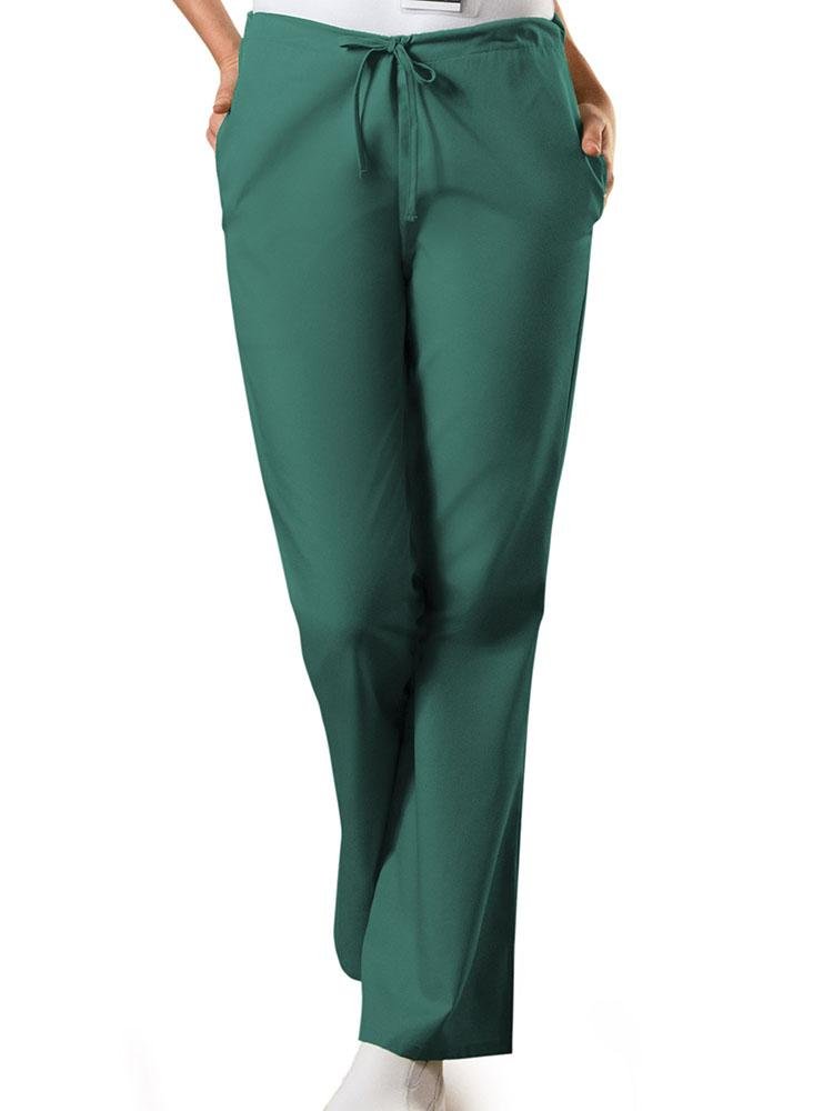 A young female Medical Assistant wearing a Cherokee Workwear Originals Women's Drawstring Flare Leg Scrub Pant in Hunter size XS Petite featuring an adjustable drawstring waist.