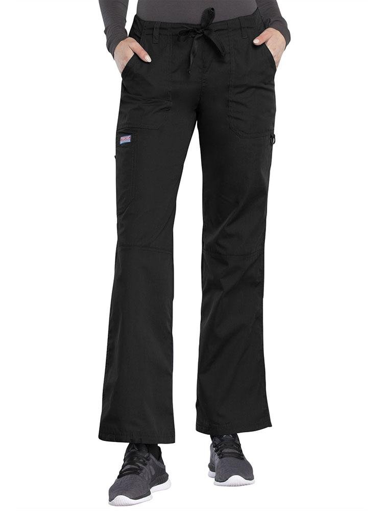 A young female Nurse Practitioner wearing a Cherokee Workwear Originals Women's Low-Rise Drawstring Scrub Pant in Black size XL Tall featuring an adjustable drawstring waist.