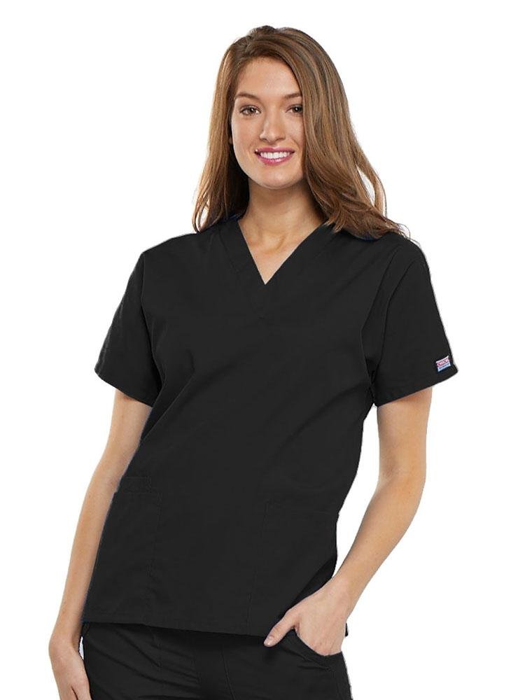 A young female EMT wearing a Cherokee Workwear Originals Women's V-neck Scrub Top in Black size 3XL featuring short sleeves.