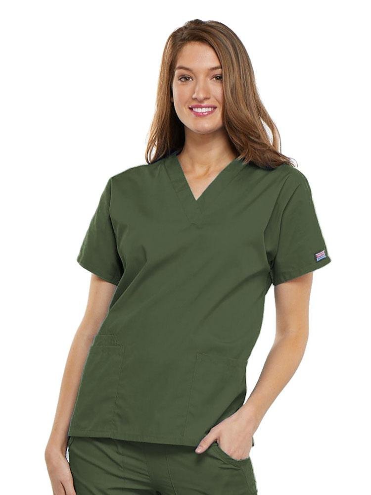 A young female Family Practitioner wearing a Cherokee Workwear Originals Women's V-neck Scrub Top in Olive size 2XL featuring short sleeves.