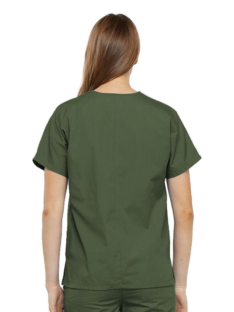 A young female Surgical Technologist wearing a Cherokee Workwear Originals Women's V-neck Scrub Top in Olive size 2XL featuring a center back length of 26.5".