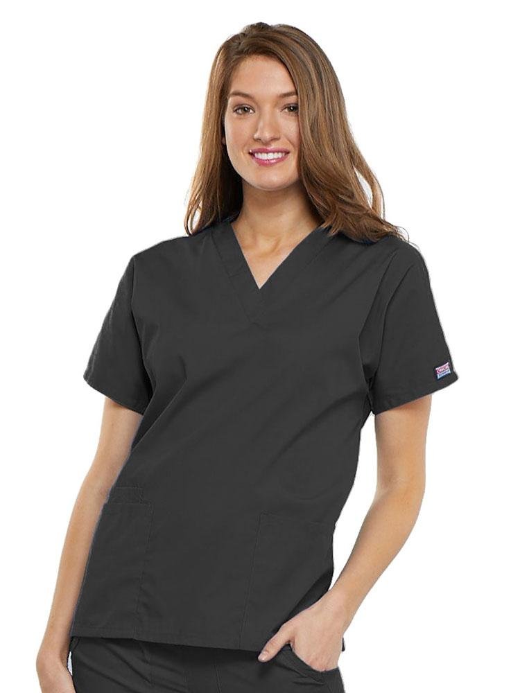 A young female LPN wearing a Cherokee Workwear Originals Women's V-neck Scrub Top in Pewter size 2XL featuring short sleeves.