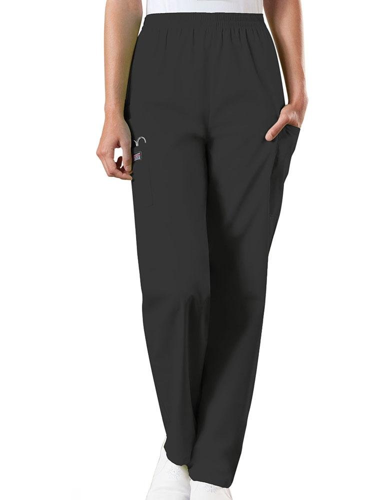 A young female Emergency Medical Technician wearing a Cherokee Workwear Originals Women's Natural Rise Tapered Pull-On Scrub Pant in Black size Large Petite featuring an elastic waist.