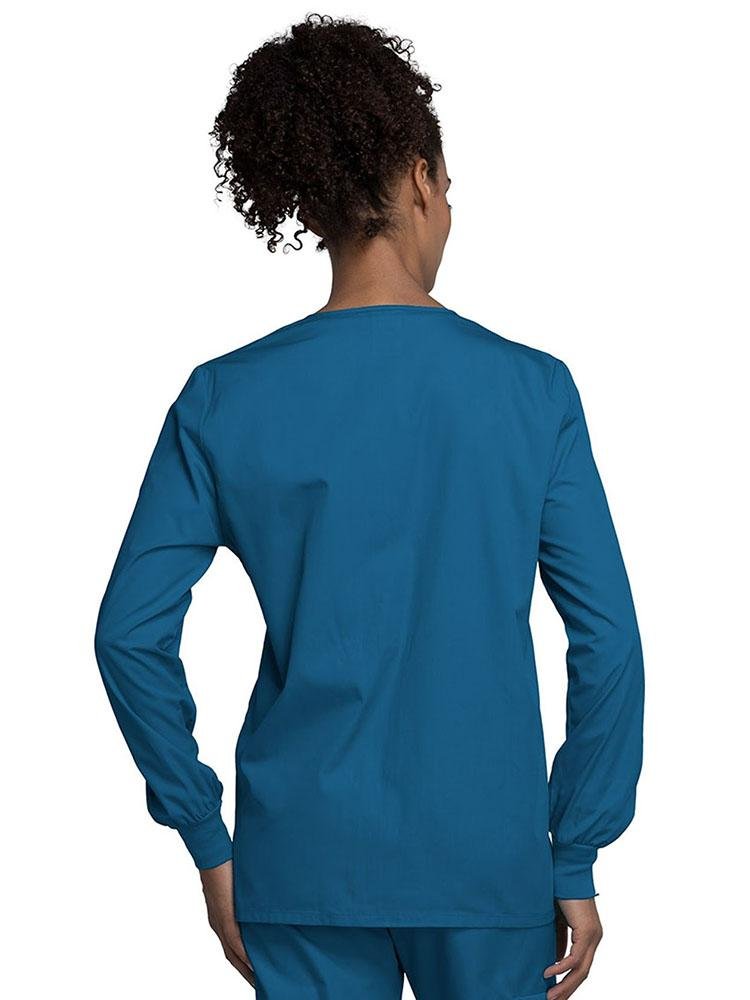 Back view of Cherokee Workwear Originals Women's Snap Front Warm-Up Jacket in Caribbean size XS featuring a center back length 27.5".