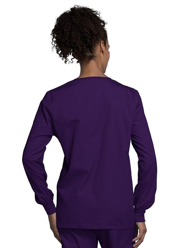 A view of the back of a Cherokee Workwear Originals Women's Snap Front Warm-Up Jacket in Eggplant style 4350.