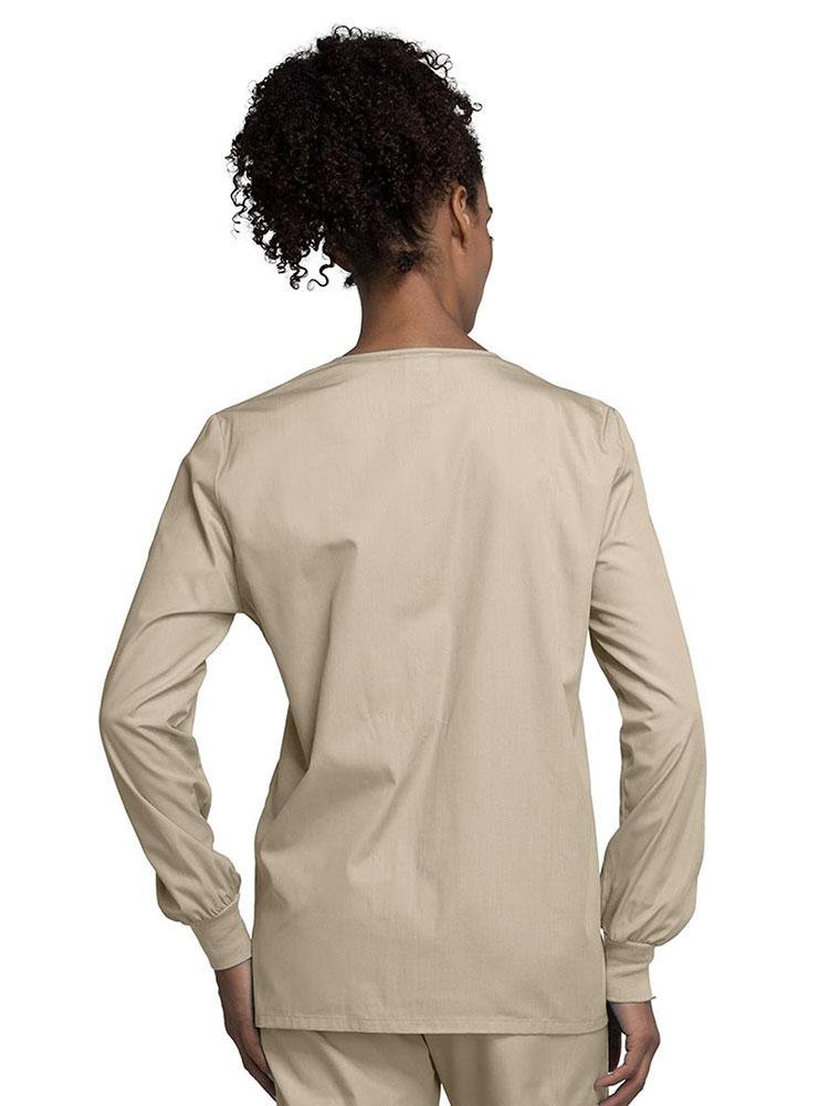 A view of the back of a Cherokee Workwear Originals Women's Snap Front Warm-Up Jacket in Khaki size Medium with soil release fabric.
