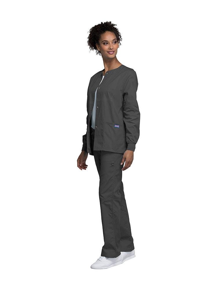 A female Dental Hygienist wearing a Cherokee Workwear Originals women's Snap Front Warm-Up Jacket in Pewter size extra extra small featuring a unique polyester/cotton blend fabric.