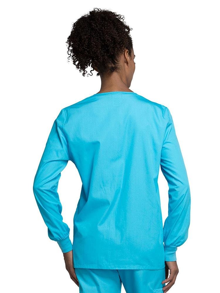 A view of the back of the Cherokee Workwear Originals Women's Snap Front Warm-Up Jacket in Turquoise style 4350 featuring a center back length of approximately 27.5".