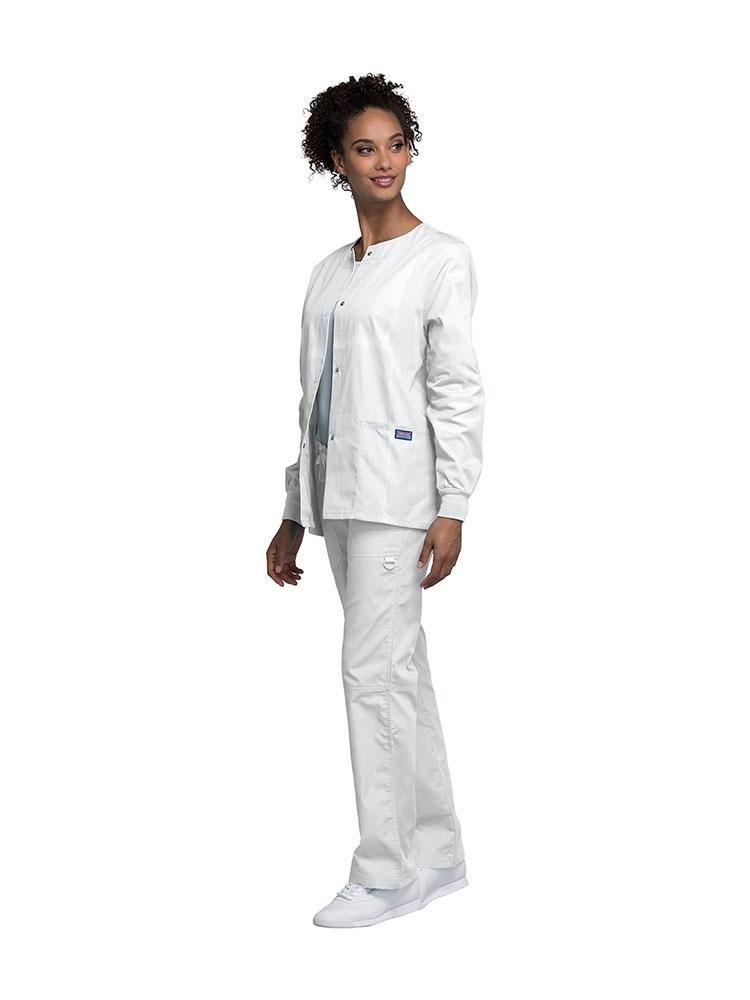 Medical Secretary wearing Cherokee Workwear Originals women's Snap Front Warm-Up Jacket in White size extra small featuring knit cuffs to provide a flattering all day fit.