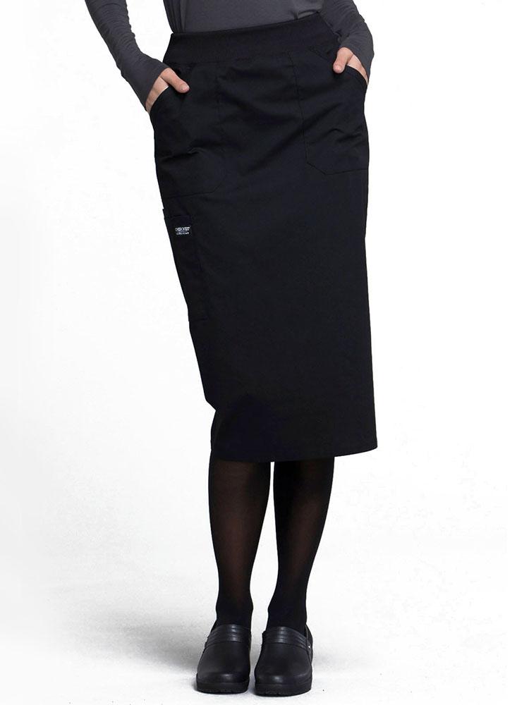 Nurse wearing Cherokee Worwear Professionals women's 30" Knit Waistband Scrub Skirt  in black size extra small