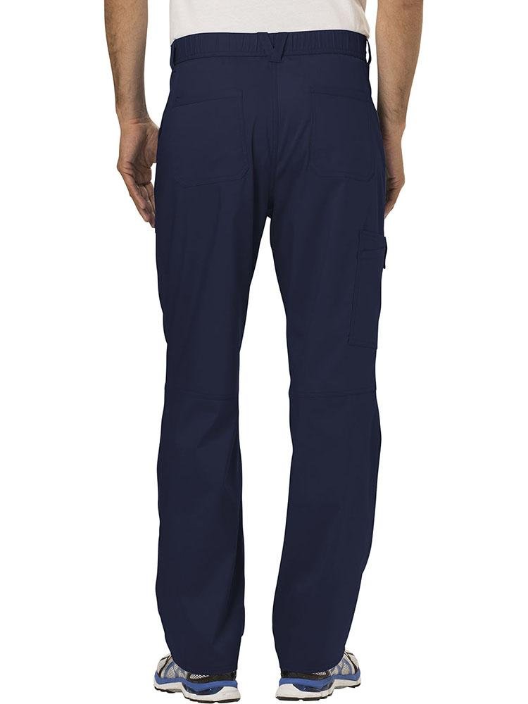 A young Male Phlebotomist displaying the back of a Cherokee Workwear Revolution Men's Drawstring Cargo Scrub Pant in Navy size small featuring 5 belt loops to provide a professional all day look & feel.