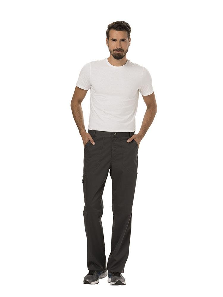 A male MRI Tech wearing a Cherokee Workwear Revolution Men's Drawstring Cargo Scrub Pant in Pewter size Medium featuring a total of 5 pockets.