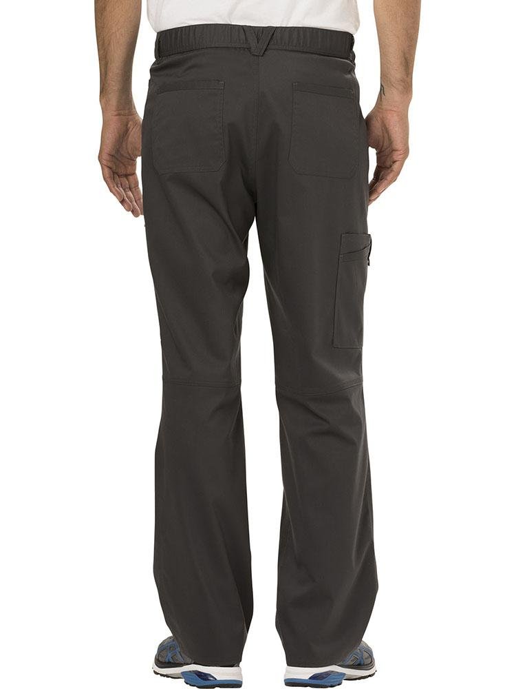 A young Male Physician's Assistant displaying the back of a Cherokee Workwear Revolution Men's Drawstring Cargo Scrub Pant in Pewter size small featuring 5 belt loops to provide a professional all day look & feel.