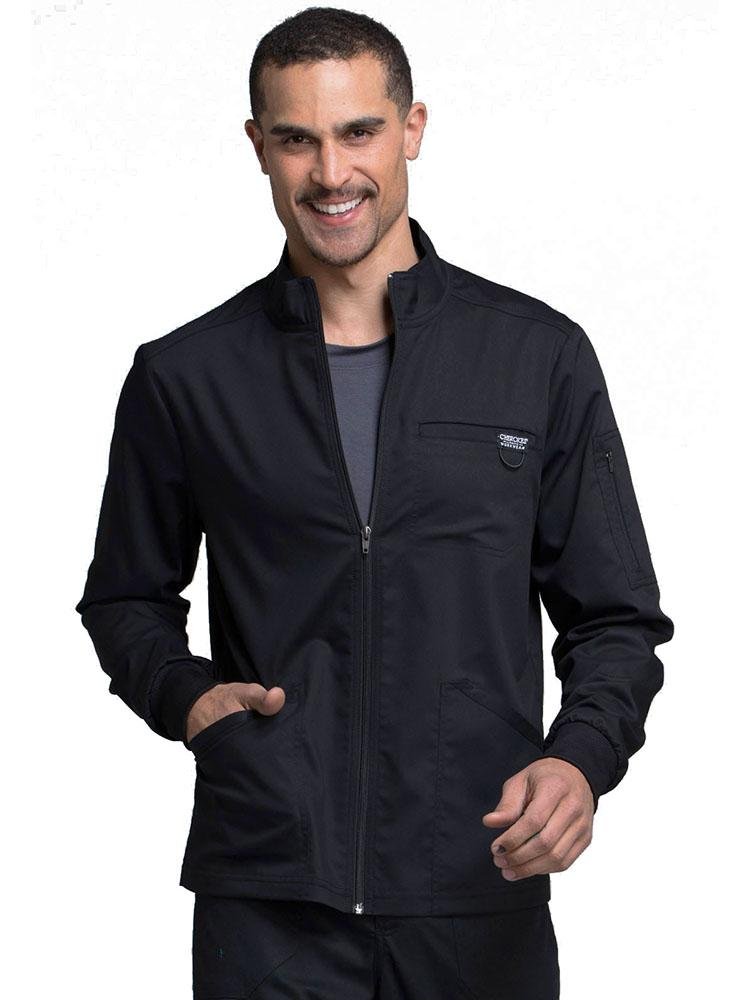 Medical Biller wearing Cherokee Workwear Revolution men's Zip Front Scrub Jacket in black size small