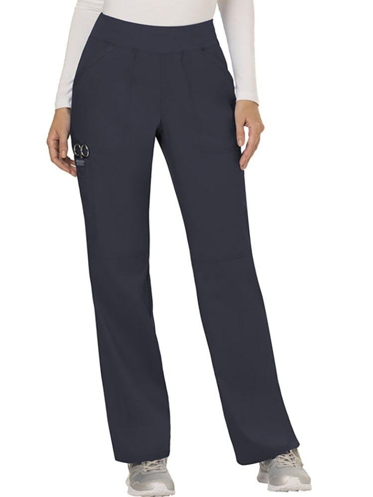 A young female Nurse wearing Cherokee Workwear Revolution women's Elastic Waistband Pull-On Scrub Pant in Pewter size Medium featuring a knit waistband.