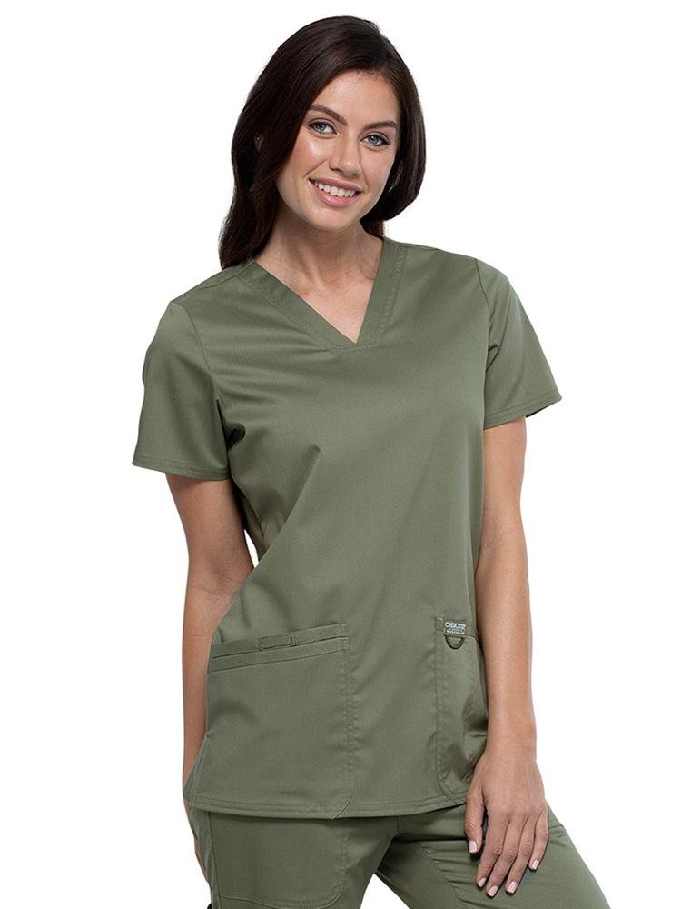 Physician wearing Cherokee Workwear Revolution women's V-Neck Scrub Top in olive size 2X