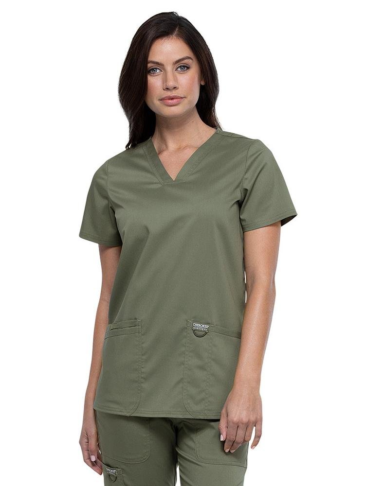 Surgical Technician wearing Cherokee Workwear Revolution women's V-Neck Scrub Top in olive size medium